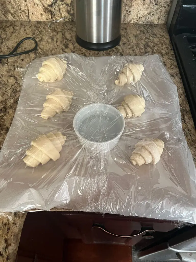 Croissants Rising On Sheet