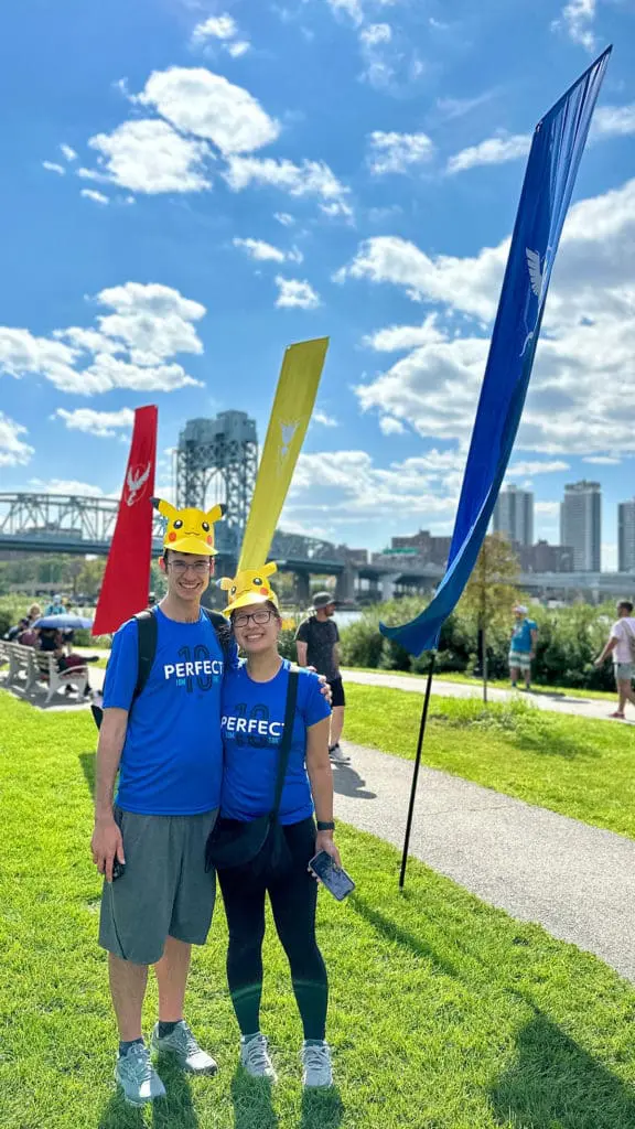 Standing near the flags in Randall's Island Park