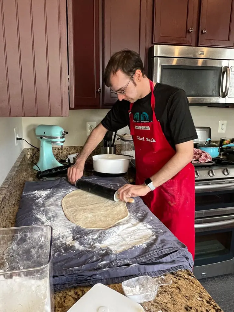 Xak rolling out the bigger povitica dough