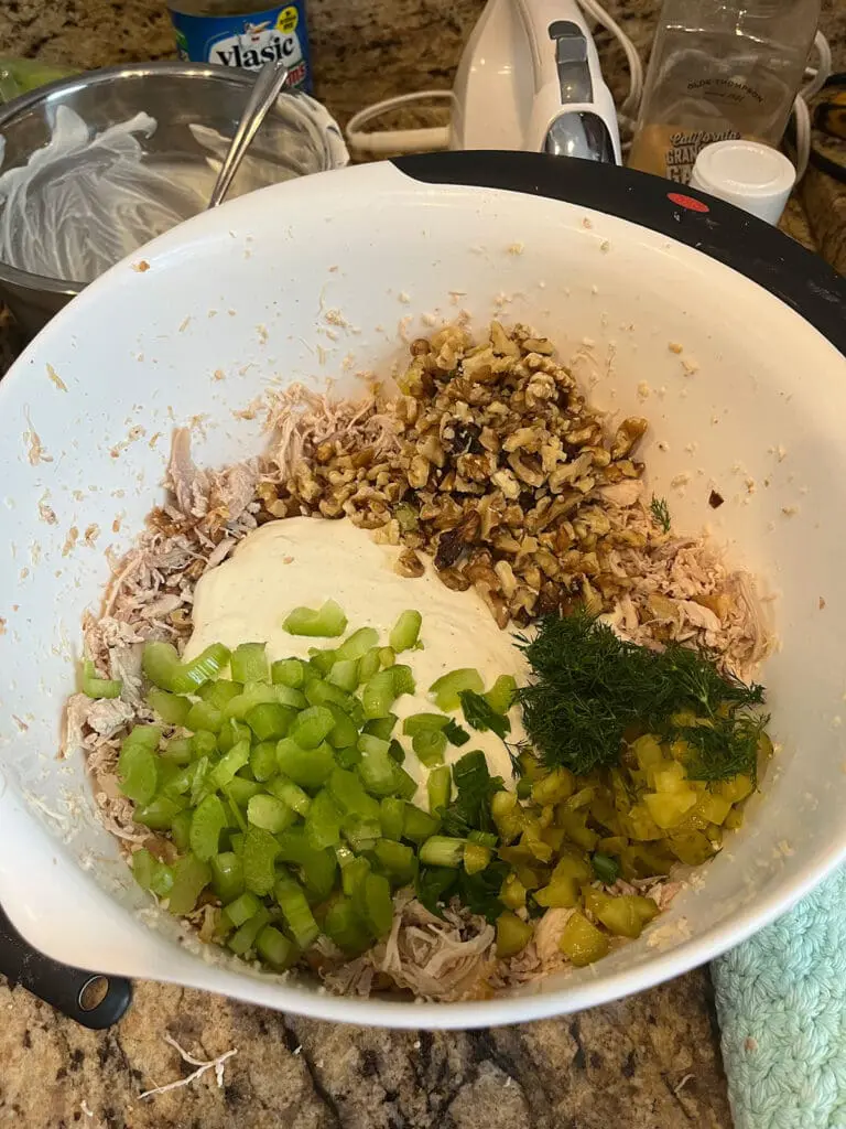 Mixing in chicken sandwich ingredients