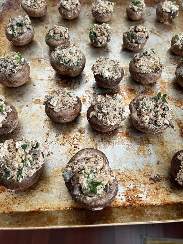 Stuffed mushrooms on baking sheet