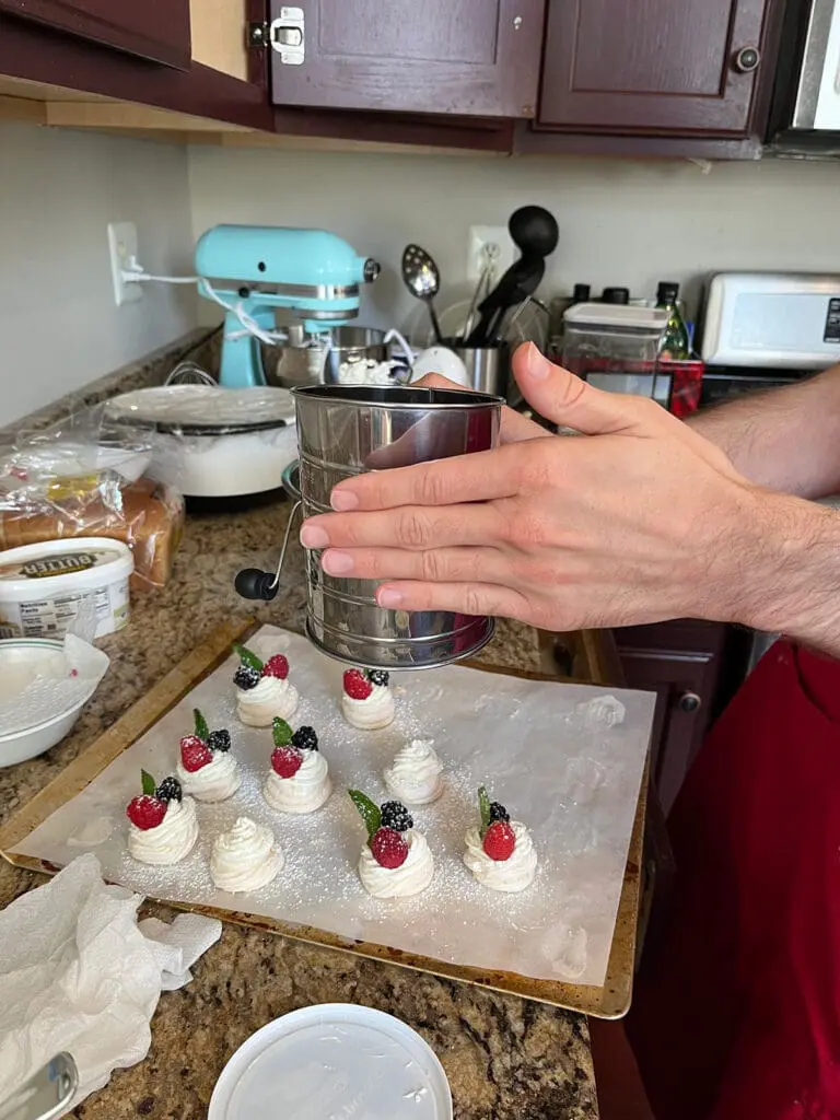 dusting pavlovas with sugar