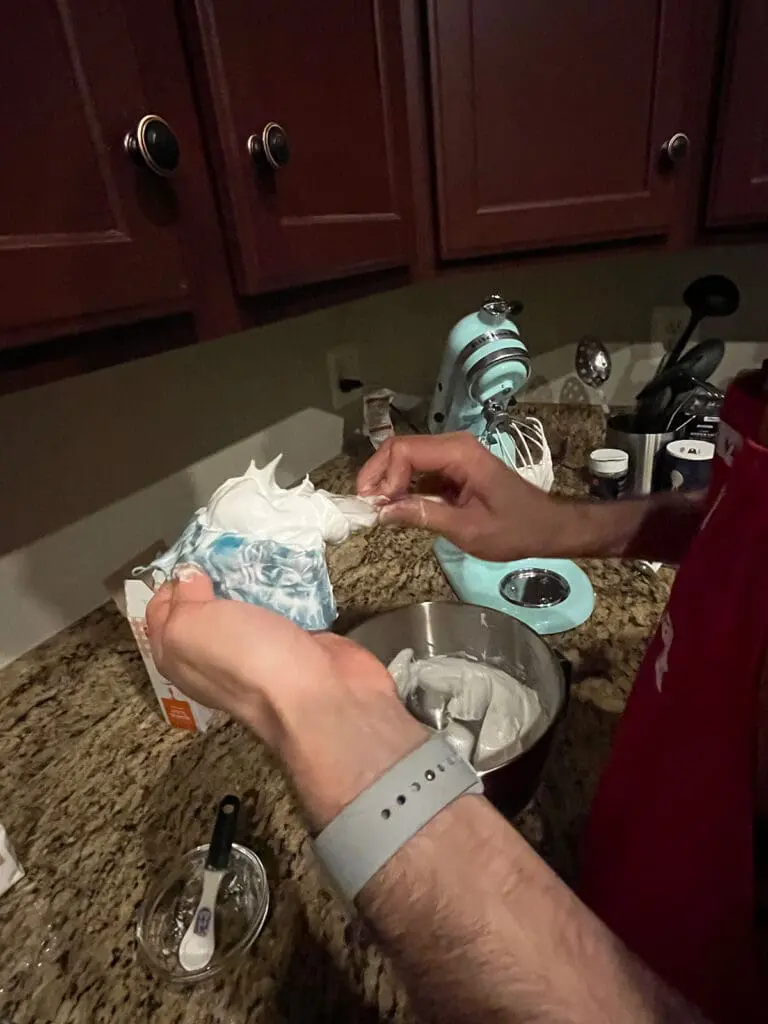 putting mixture into piping bag