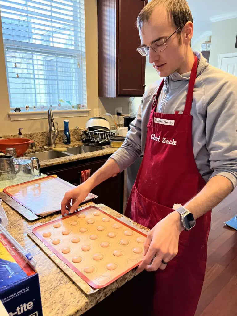 Dropping macaron cookie sheet on counter