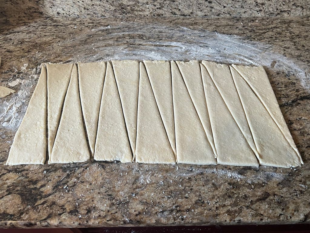 Croissant dough cut into triangles