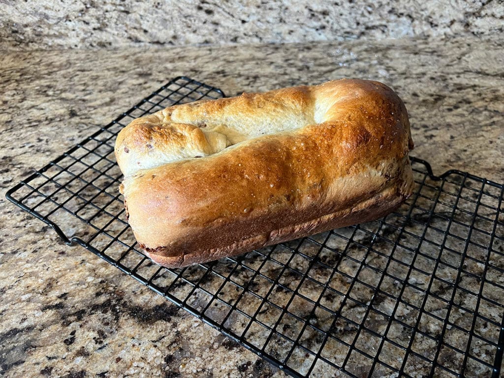 Povitica loaf cooling on wire rack