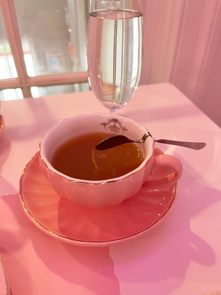 Teacup with spoon resting on lip
