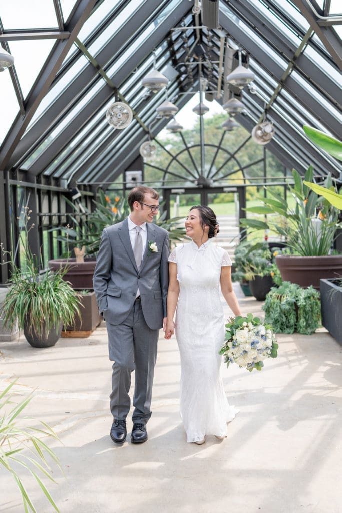 Xak and Dani at their wedding in a greenhouse