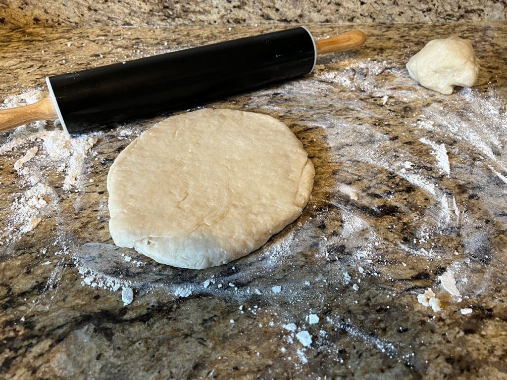 Rolling out hot water crust pastry dough