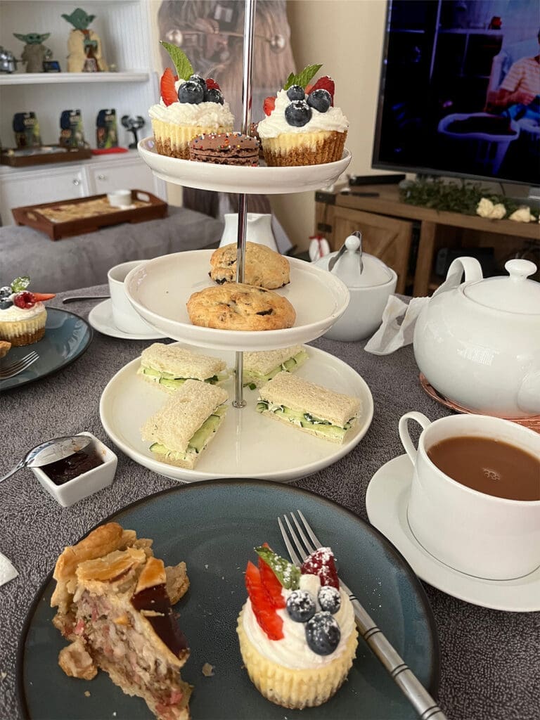 Three tiered tray casual afternoon tea with mini cheesecakes