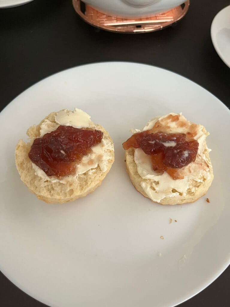 Cream scone with cream and jam