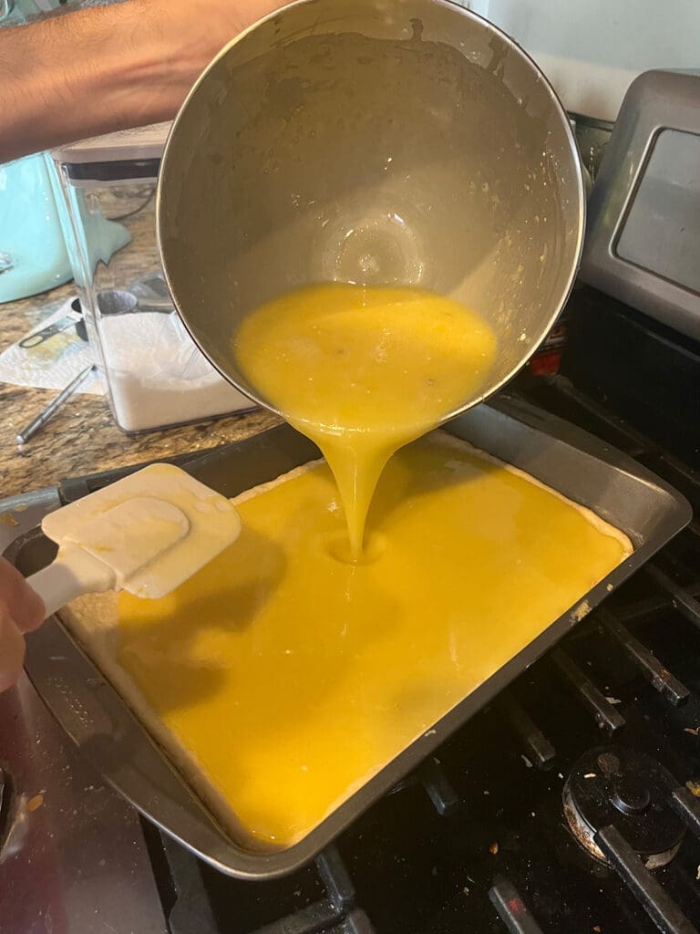 Lemon Bar filling being poured