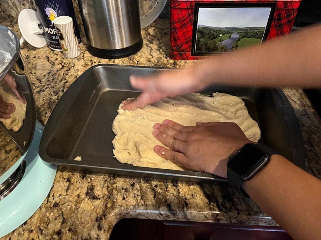patting the lemon bar dough