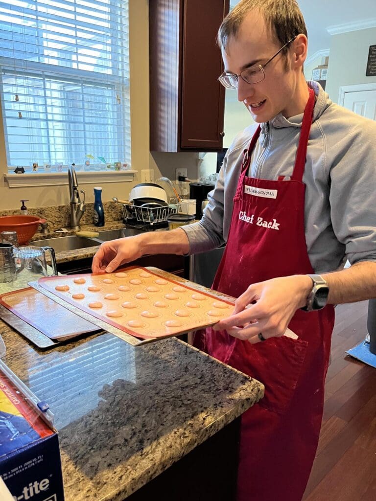 Preparing to drop macaron cookie sheet